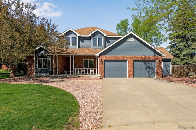 2613 Fox Run Ct, Fort Collins, CO 80526 - traditional-style house with covered porch, an attached garage, concrete driveway, brick siding, and a front yard