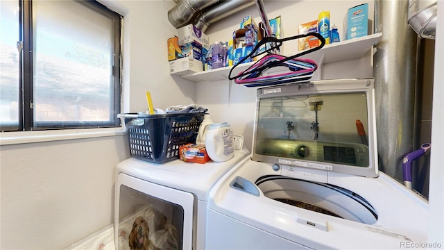 laundry room with washing machine and dryer