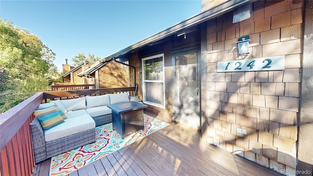 deck featuring an outdoor living space