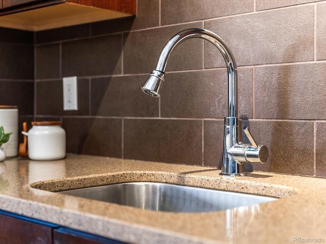 interior details with sink and backsplash