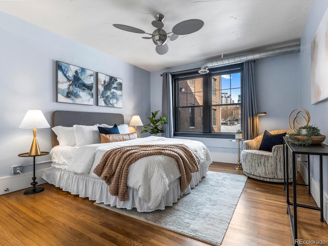 bedroom featuring wood-type flooring and ceiling fan