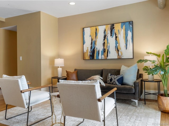 living room featuring recessed lighting, wood finished floors, and baseboards