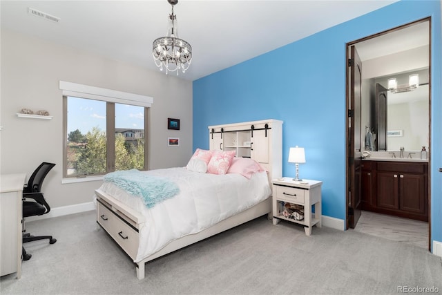 bedroom featuring light carpet, a chandelier, a sink, and baseboards
