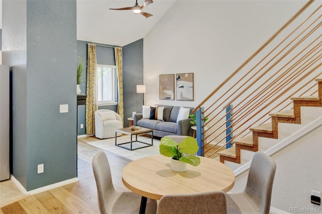 11358 W 85th Pl Unit E, Arvada, CO 80005 - dining room with a textured wall, high vaulted ceiling, ceiling fan, wood finished floors, and stairway
