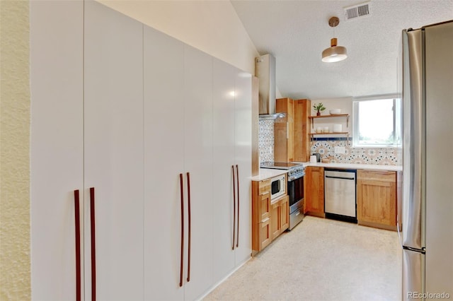 11358 W 85th Pl Unit E, Arvada, CO 80005 - kitchen with stainless steel appliances, range hood, open shelves, light countertops, and decorative backsplash