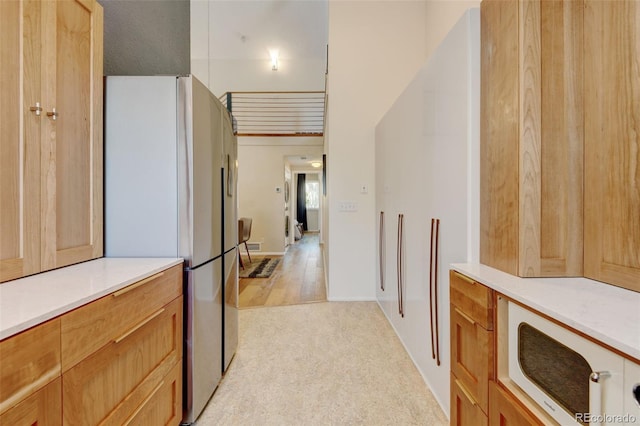 11358 W 85th Pl Unit E, Arvada, CO 80005 - hallway with light carpet