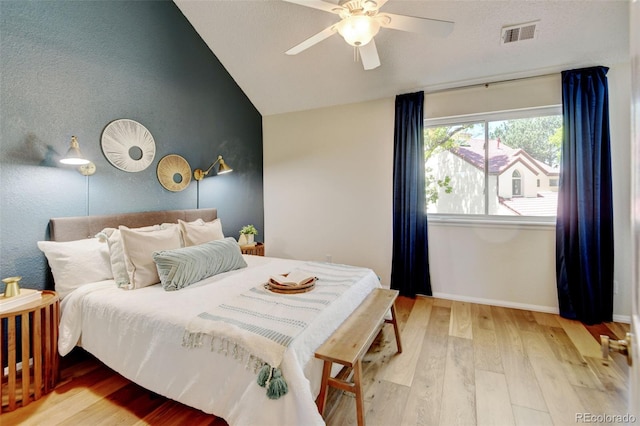 11358 W 85th Pl Unit E, Arvada, CO 80005 - bedroom featuring lofted ceiling, wood finished floors, baseboards, and a ceiling fan
