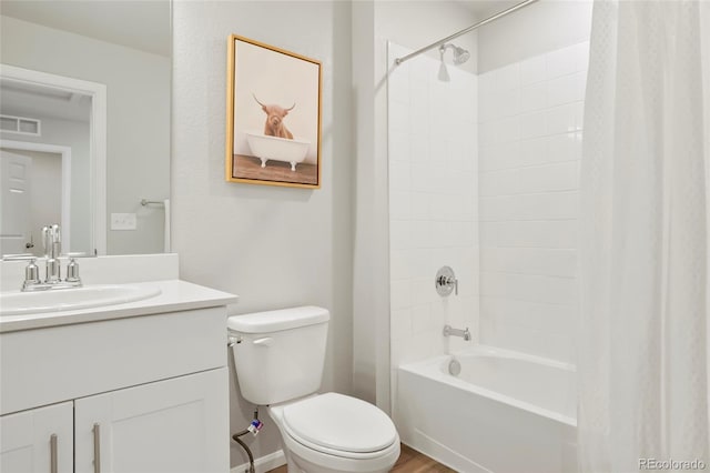 bathroom featuring toilet, shower / tub combo, visible vents, and vanity