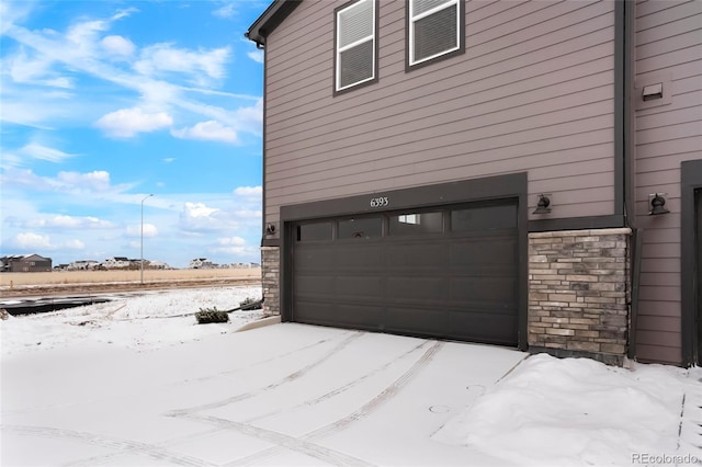 view of snow covered garage