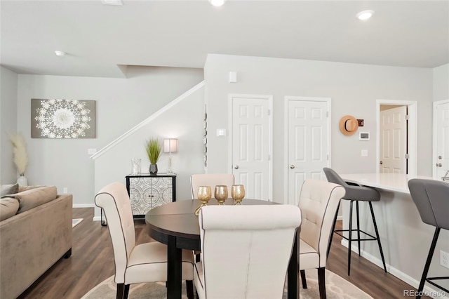 dining space featuring baseboards, recessed lighting, and dark wood-style floors