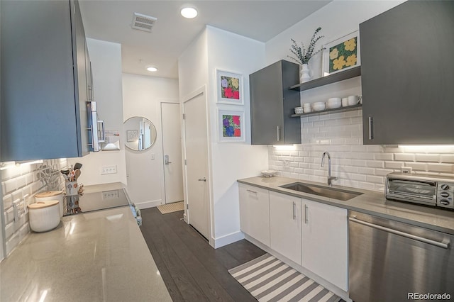 kitchen with dark wood-style floors, open shelves, white cabinetry, a sink, and dishwasher