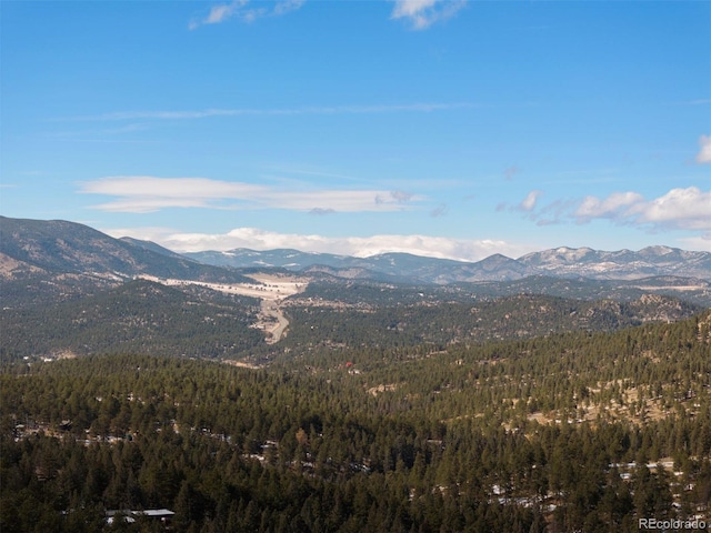 mountain view featuring a forest view