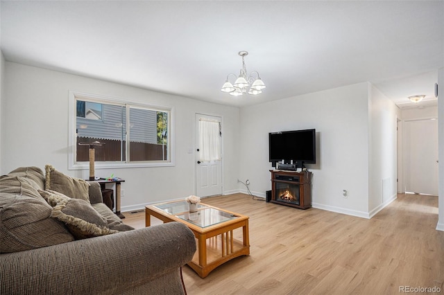 1641 Biscay Cir, Aurora, CO 80011 - living room with light wood-style flooring and a chandelier