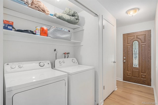 1641 Biscay Cir, Aurora, CO 80011 - laundry room with independent washer and dryer and light wood finished floors