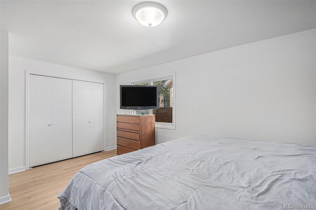 1641 Biscay Cir, Aurora, CO 80011 - bedroom with wood finished floors and a closet