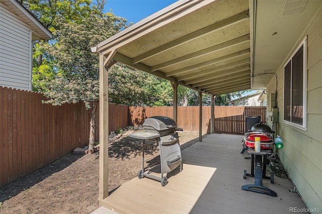 1641 Biscay Cir, Aurora, CO 80011 - wooden deck featuring a fenced backyard and a grill