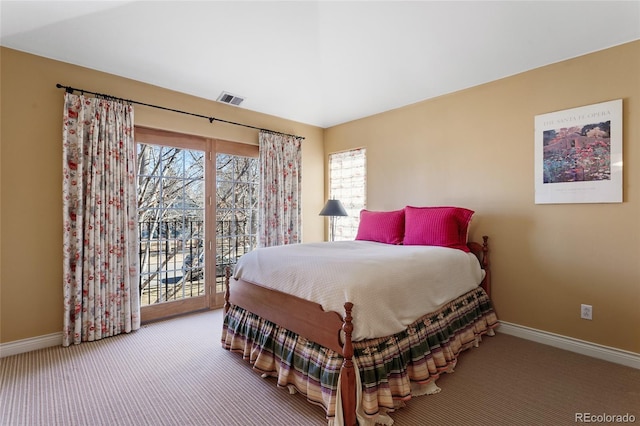 bedroom with visible vents, multiple windows, carpet, and access to outside