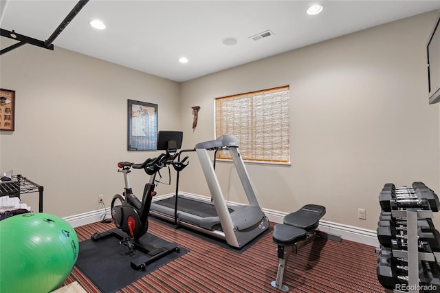 exercise area featuring recessed lighting, baseboards, and visible vents