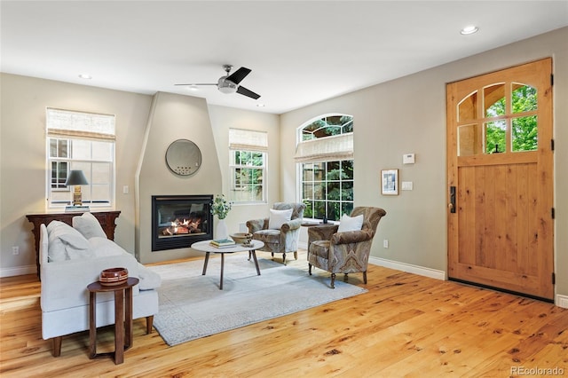 2411 S Milwaukee St, Denver, CO 80210 - living room featuring wood finished floors, baseboards, recessed lighting, a large fireplace, and a ceiling fan