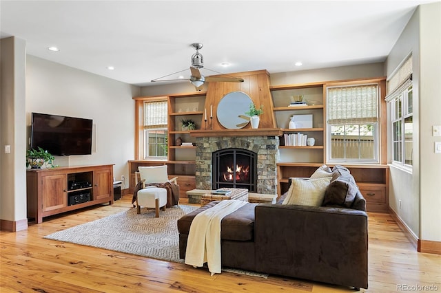 2411 S Milwaukee St, Denver, CO 80210 - living area featuring a fireplace, light wood-style flooring, baseboards, a ceiling fan, and recessed lighting