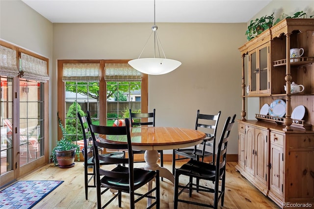 2411 S Milwaukee St, Denver, CO 80210 - dining space with light wood-style flooring