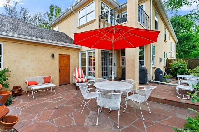 2411 S Milwaukee St, Denver, CO 80210 - view of patio with a balcony, outdoor dining space, and grilling area