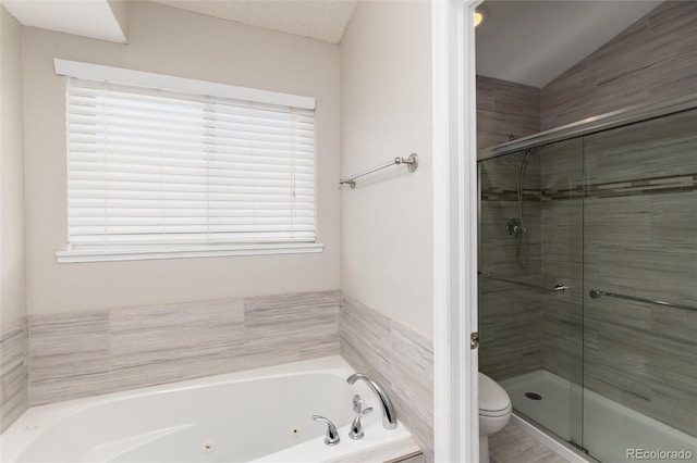 bathroom featuring toilet, a jetted tub, a shower stall, and vaulted ceiling