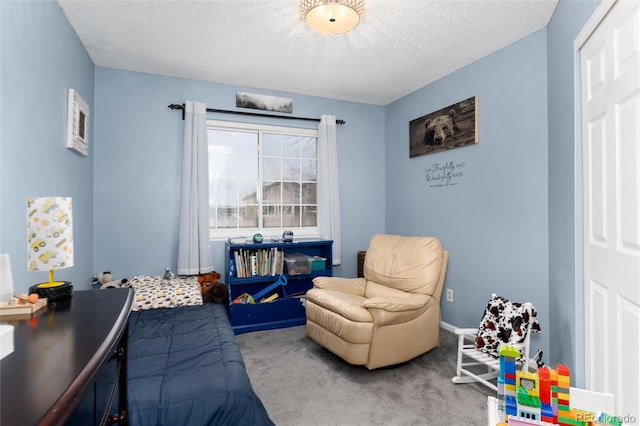 bedroom with a textured ceiling and carpet floors