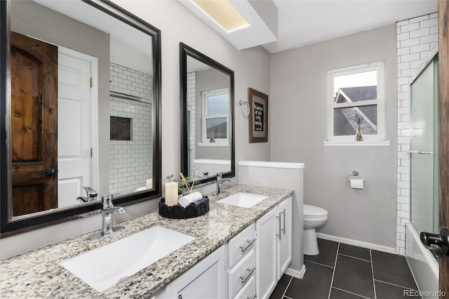 full bathroom featuring a sink, toilet, walk in shower, and tile patterned flooring