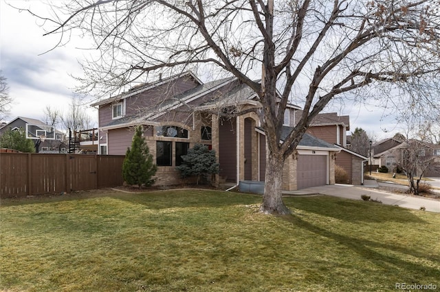 view of front of property with a residential view, concrete driveway, a front yard, and fence