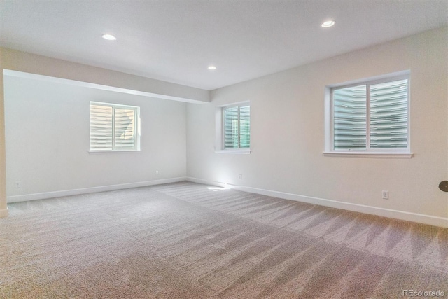 empty room featuring light carpet