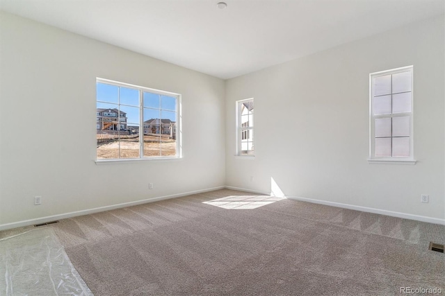 spare room featuring carpet flooring