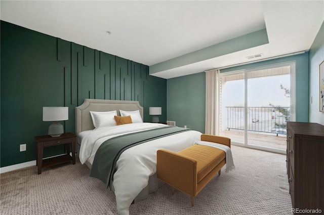 bedroom with baseboards, access to outside, visible vents, and light colored carpet