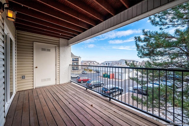 wooden deck with a residential view