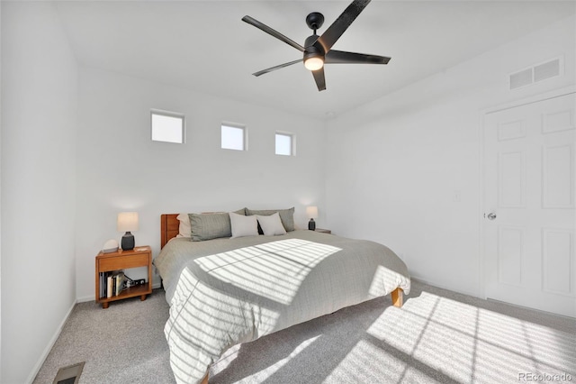 bedroom with a ceiling fan, carpet flooring, visible vents, and baseboards