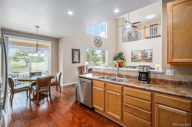 7004 S Addison Ct, Aurora, CO 80016 - kitchen with stainless steel dishwasher, a sink, dark wood finished floors, a chandelier, and healthy amount of natural light