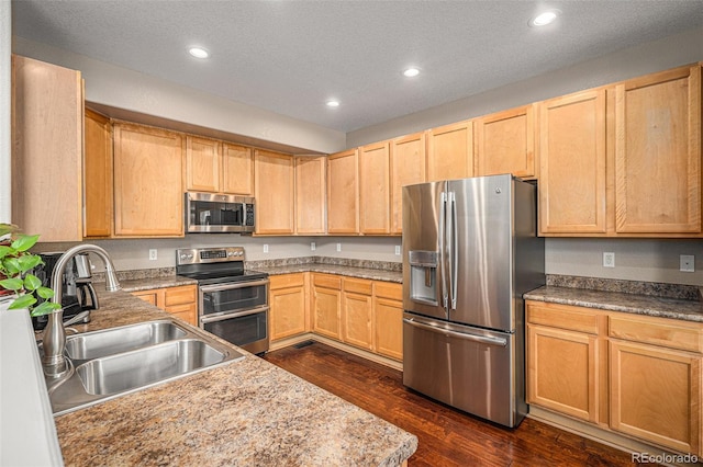 7004 S Addison Ct, Aurora, CO 80016 - kitchen with stainless steel appliances, a sink, light brown cabinets, recessed lighting, and dark wood-type flooring