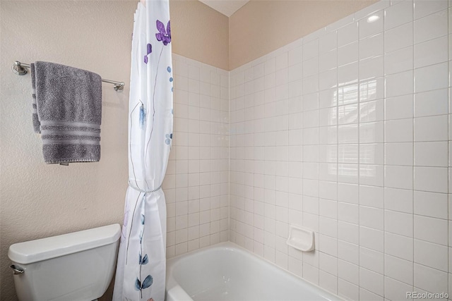 7004 S Addison Ct, Aurora, CO 80016 - bathroom featuring shower / bath combination with curtain and toilet