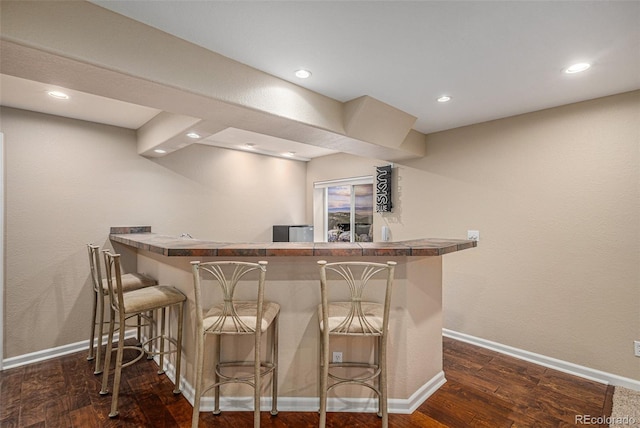 7004 S Addison Ct, Aurora, CO 80016 - indoor wet bar with dark wood-style floors, recessed lighting, and baseboards