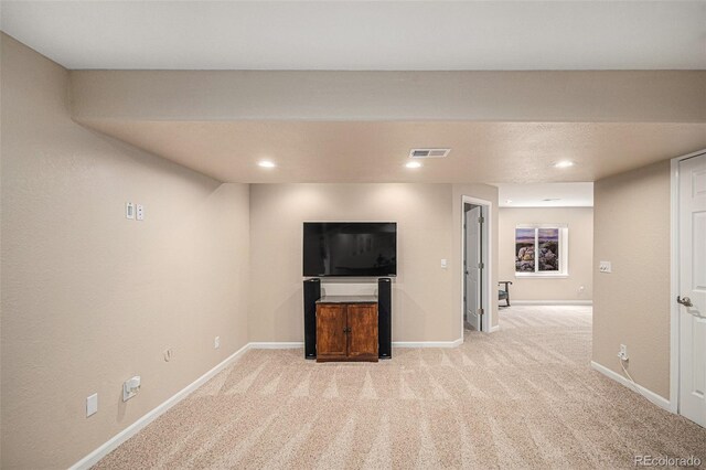 7004 S Addison Ct, Aurora, CO 80016 - unfurnished living room with light colored carpet, baseboards, and recessed lighting