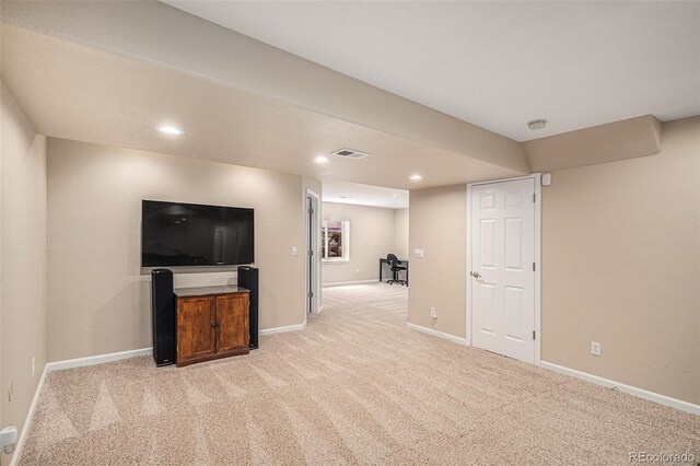 7004 S Addison Ct, Aurora, CO 80016 - finished below grade area featuring light carpet, baseboards, and recessed lighting