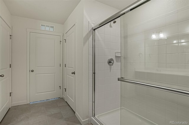 full bathroom with a stall shower and visible vents