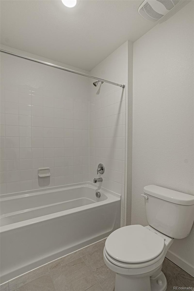 bathroom featuring tile patterned floors, toilet, visible vents, and shower / bath combination