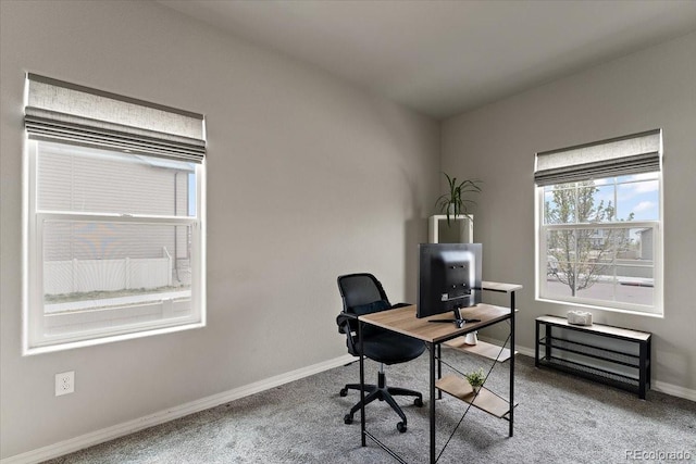 carpeted home office featuring baseboards