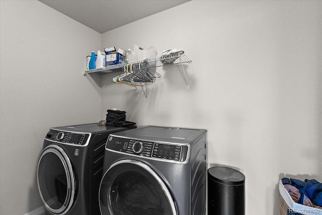 laundry area with laundry area and separate washer and dryer