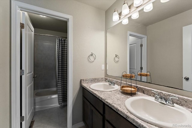 bathroom featuring double vanity, tile patterned flooring, shower / bath combination with curtain, and a sink