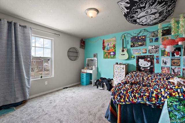 carpeted bedroom featuring baseboards