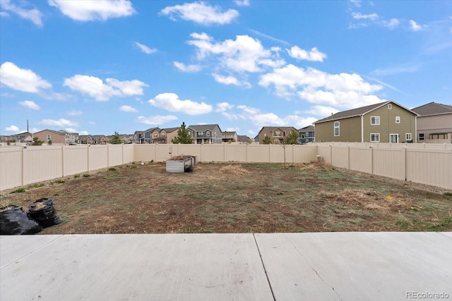 view of yard featuring a residential view and fence