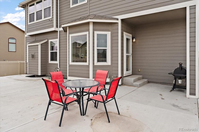 view of patio / terrace featuring fence, area for grilling, and outdoor dining space