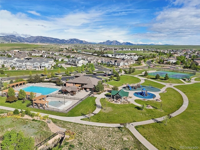 9139 Flora St, Arvada, CO 80005 - aerial view of residential area with a pool area and a mountainous background